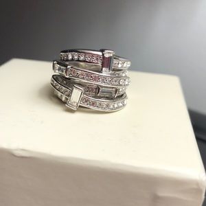Costume jewelry CZ ring. Not sure type of metal.